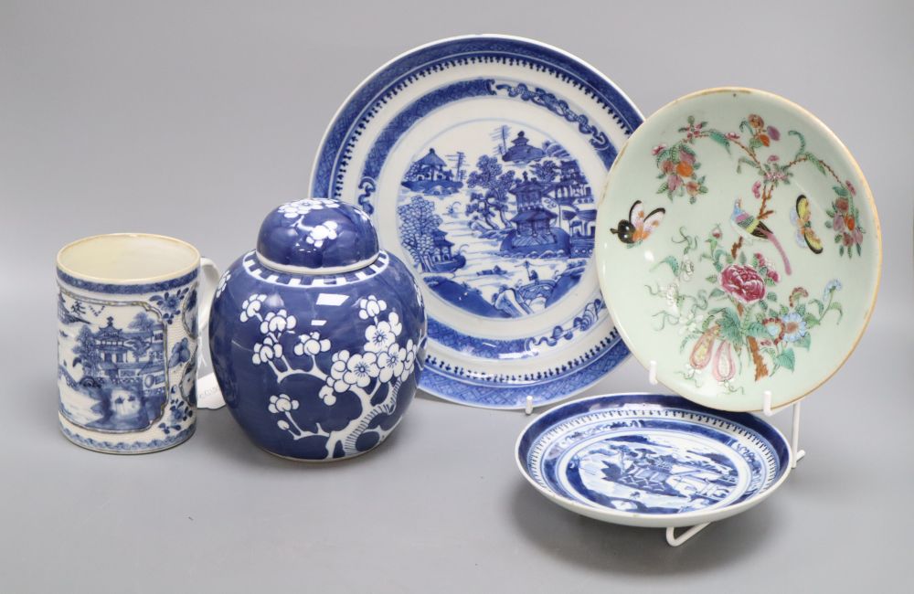 Five pieces of Chinese ceramics including two blue and white plates, a Canton plate, a blue and white mug and a prunus jar and cover,